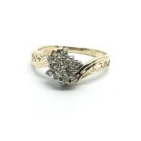 A 14ct gold diamond cluster ring in the form of a