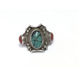 A silver ring set with cornelian and a turquoise c