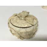 A carved ivory box and cover with profuse carved lotus leaves and foliage. 11cmx 9cm