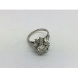 An 18ct white gold floral design diamond cluster r