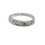 An 18ct white gold sapphire and diamond half etern