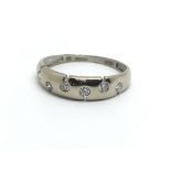 An 18ct white gold six stone diamond ring, approx