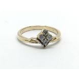 An unmarked gold four stone diamond ring, approx.1
