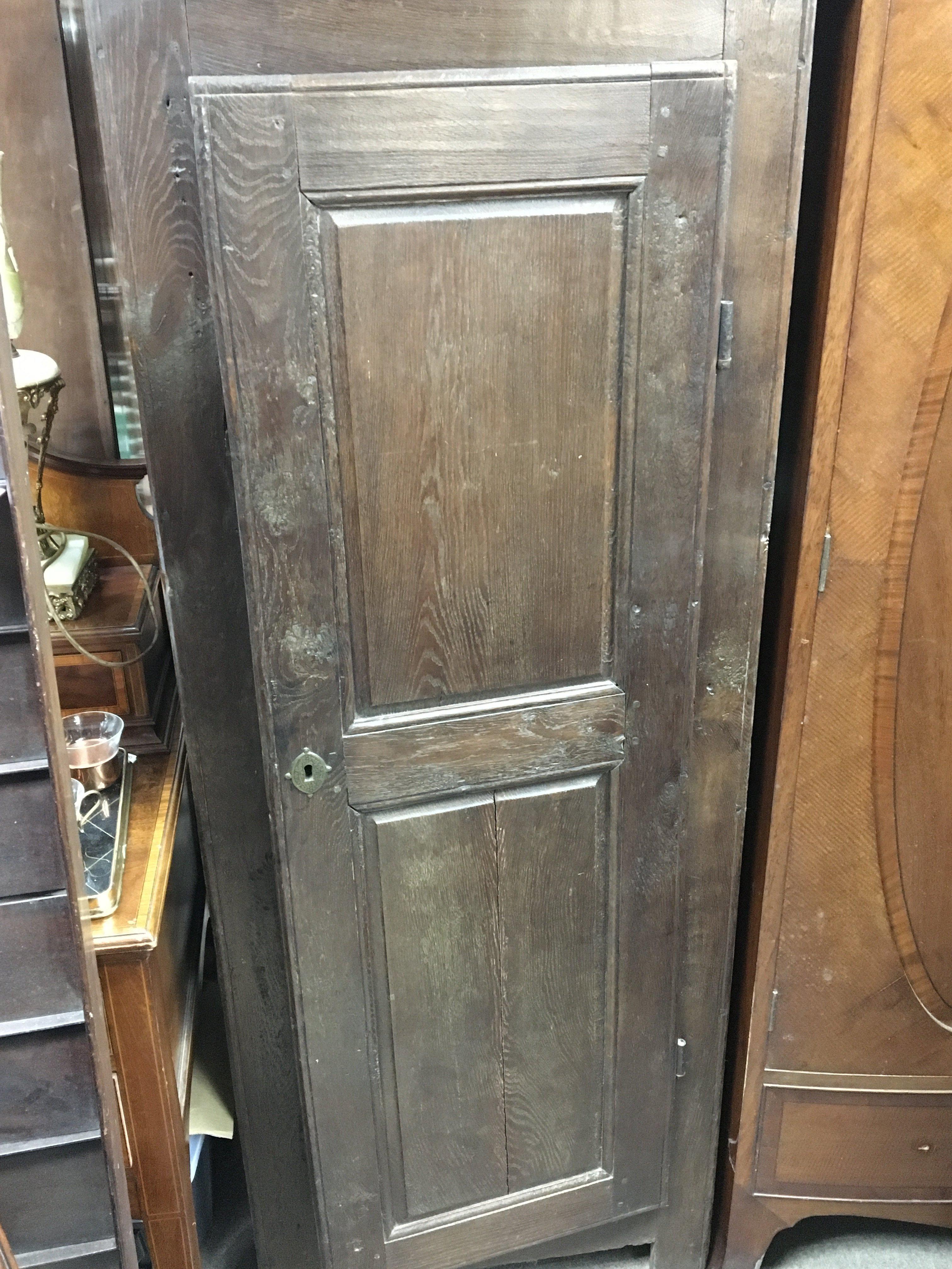 An oak single door hall robe or small wardrobe solid sides and panelled doors. Hight 175cm x 65cm