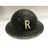 A WW2 era tin hat marked R to the front - NO RESER