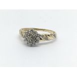A 9ct gold diamond cluster ring, approx 1.8g and a