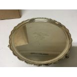 A silver tray with a shaped edge on small feet Sheffield hallmarks. Weight 518g