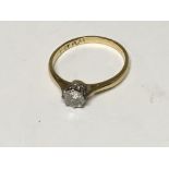 An 18carat gold and platinum ring set with a solitaire diamond approximately 0.40 of a carat ring