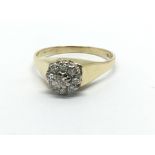 An 18ct gold nine stone diamond ring in the form o