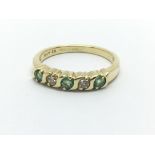 An 18ct gold emerald and diamond ring, approx 3.6g and approx size N.