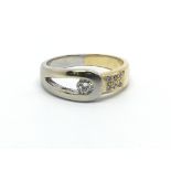 An 18ct white and yellow gold ring with approx 0.2