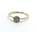 An 18ct gold diamond cluster ring in the form of a
