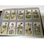 An album of cigarette cards including Wills, Players ,Lambert & Butler, Gallagher etc