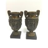 A pair of classical gilt urns, approx height 22cm.
