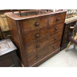 A Victorian mahogany chest of drawers fitted with two and three long drawers .
