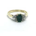 An Art Deco style 18ct gold ring set with a centra