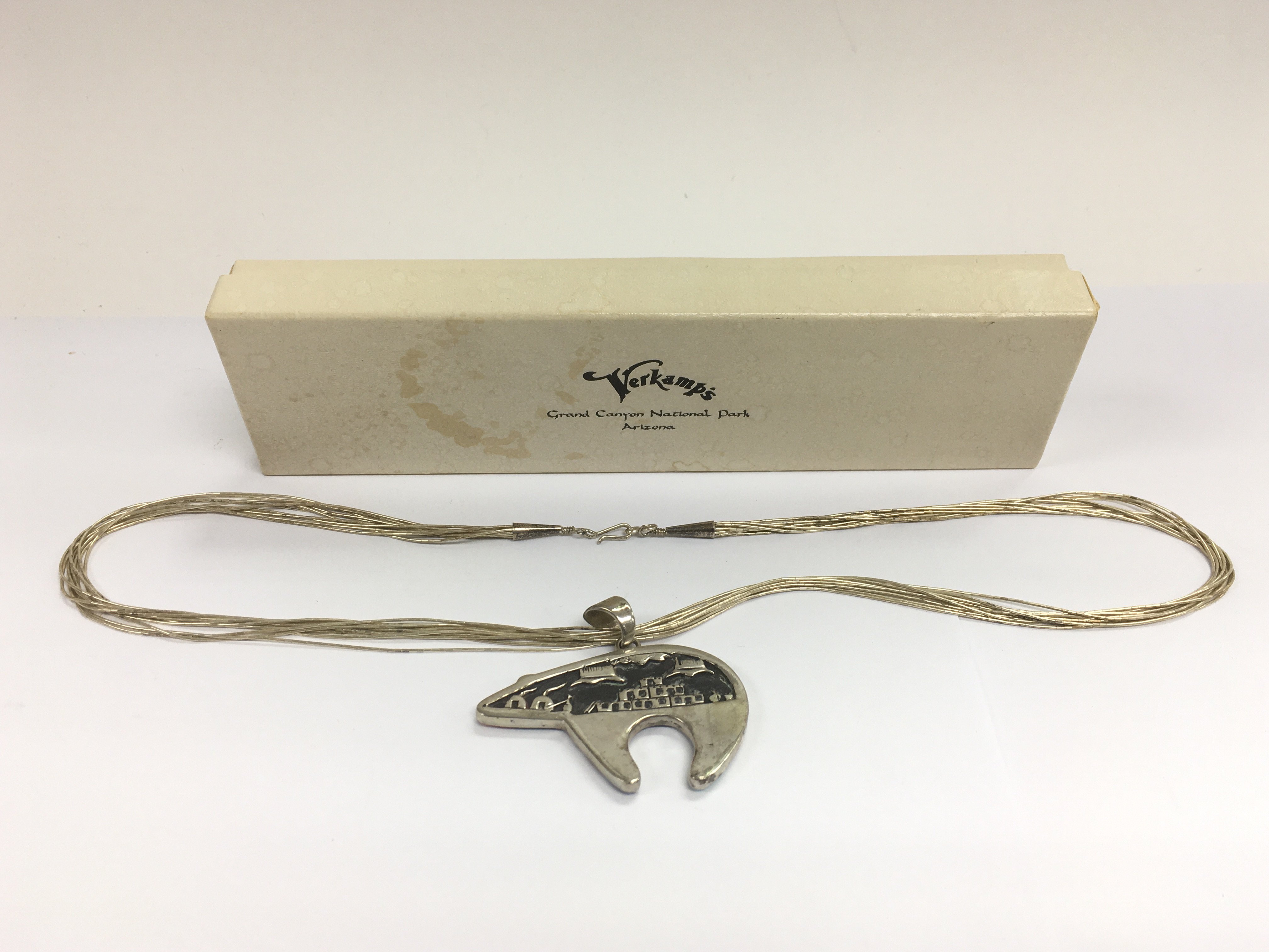 A boxed Verkamps native American silver necklace.