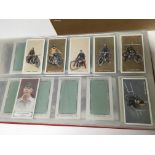 An album of cigarette cards including Dirt Track Riders, Pattreiouex Cricketers, Billiards and A few