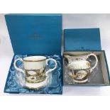 A boxed limited edition Coalport Iron bridge two handled tankard and one other of a jug (2).