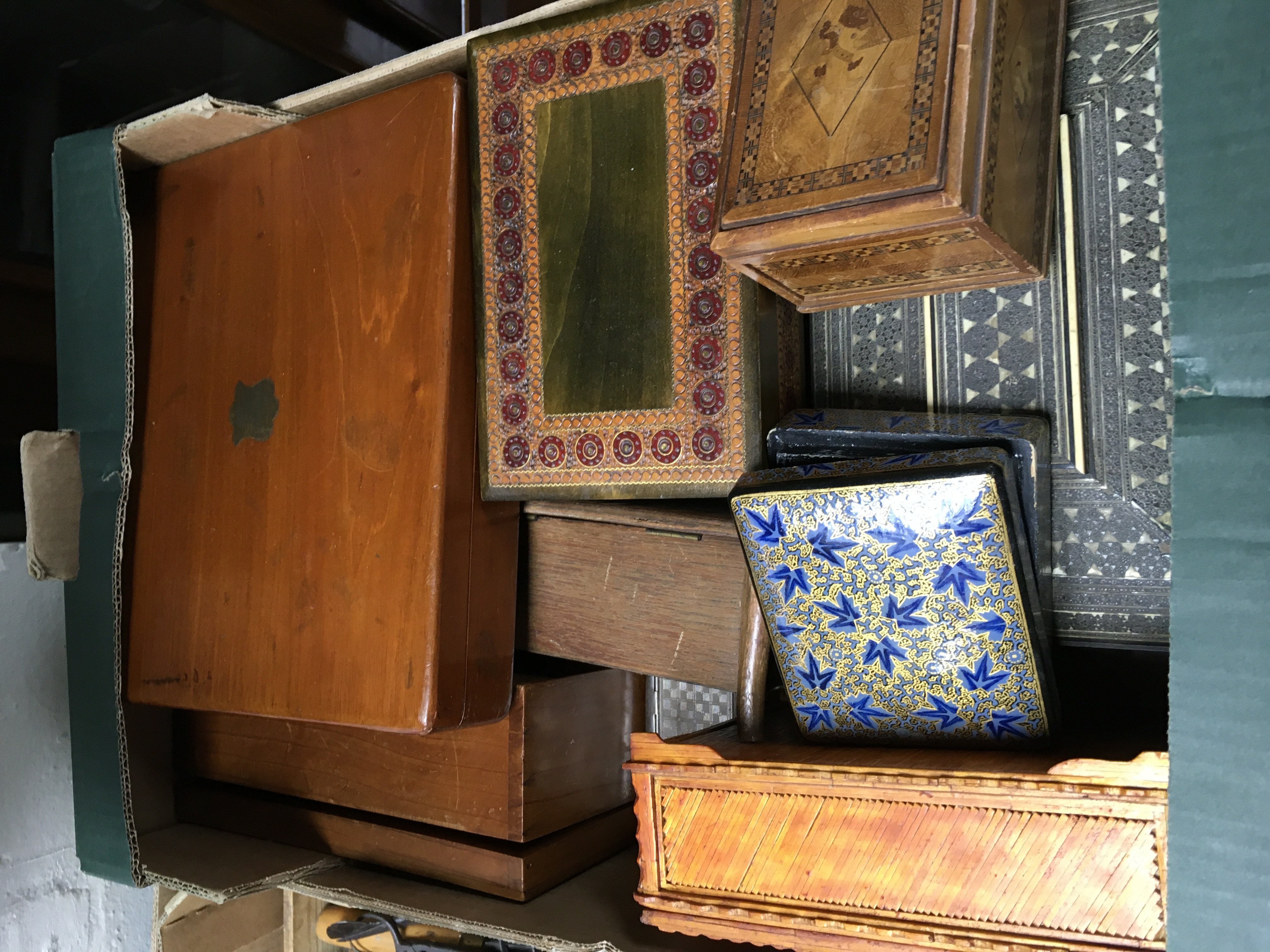 A large collection of tins and boxes and wooden tr