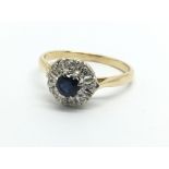 An unmarked gold sapphire and diamond cluster ring