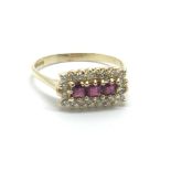 An 18ct gold ruby and diamond ring, approx.33ct, a