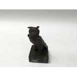 Small heavy metal painted figure of an owl on green marble base