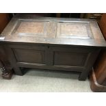 An 18th century chest with a panelled top and front 94x36cm