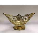 A silver gilt basket with piercework decoration, approx height 13.5cm, London 1907.