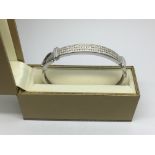 A 9ct white gold diamond set bangle, approx 20g.