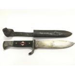 A WW2 Hitler youth dagger and sheath.