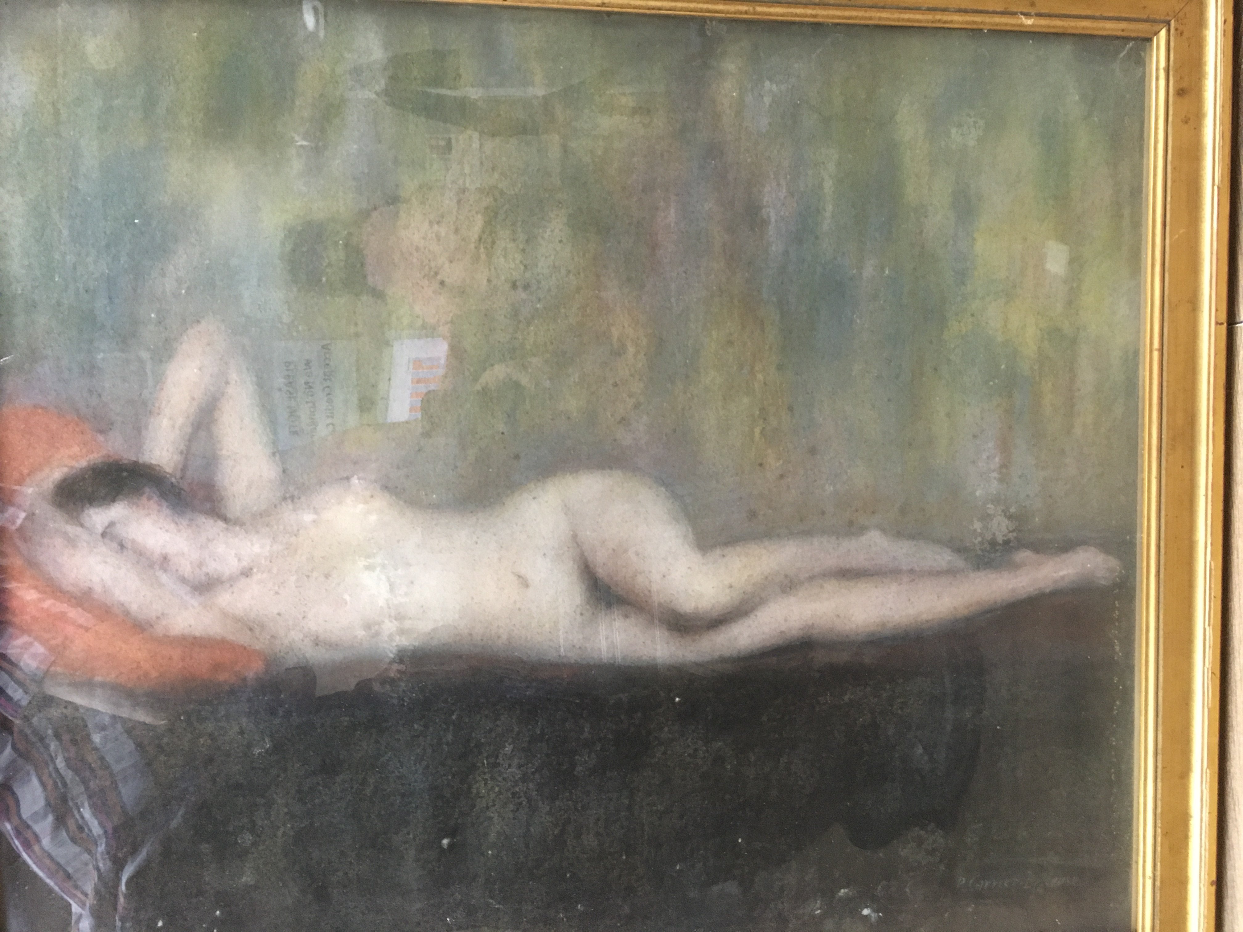 A framed picture depicting a reclining nude maiden