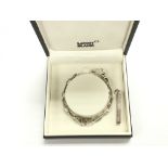 A boxed Mont Blanc silver bracelet and a silver ingot pendant (2).