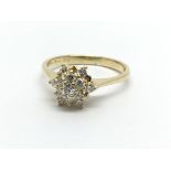 An 18ct gold diamond cluster ring in the form of a