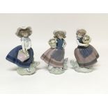 Three more Lladro figures, of ladies with baskets of flowers