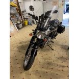 A Triumph T100, Registration May 2010, with comprehensive list of extras including Triumph black