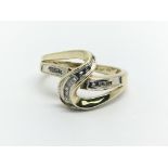 A 10k gold diamond swirl ring, approx 3.1g and app