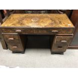 A walnut desk fitted with two short and two long drawers on bracket feet .48 cm by 110 cm .