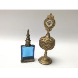 Unusual vintage gilt filigree perfume bottle with glass liner and lift out glass dropper, along with