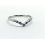 A 9ct white gold sapphire and diamond wishbone rin