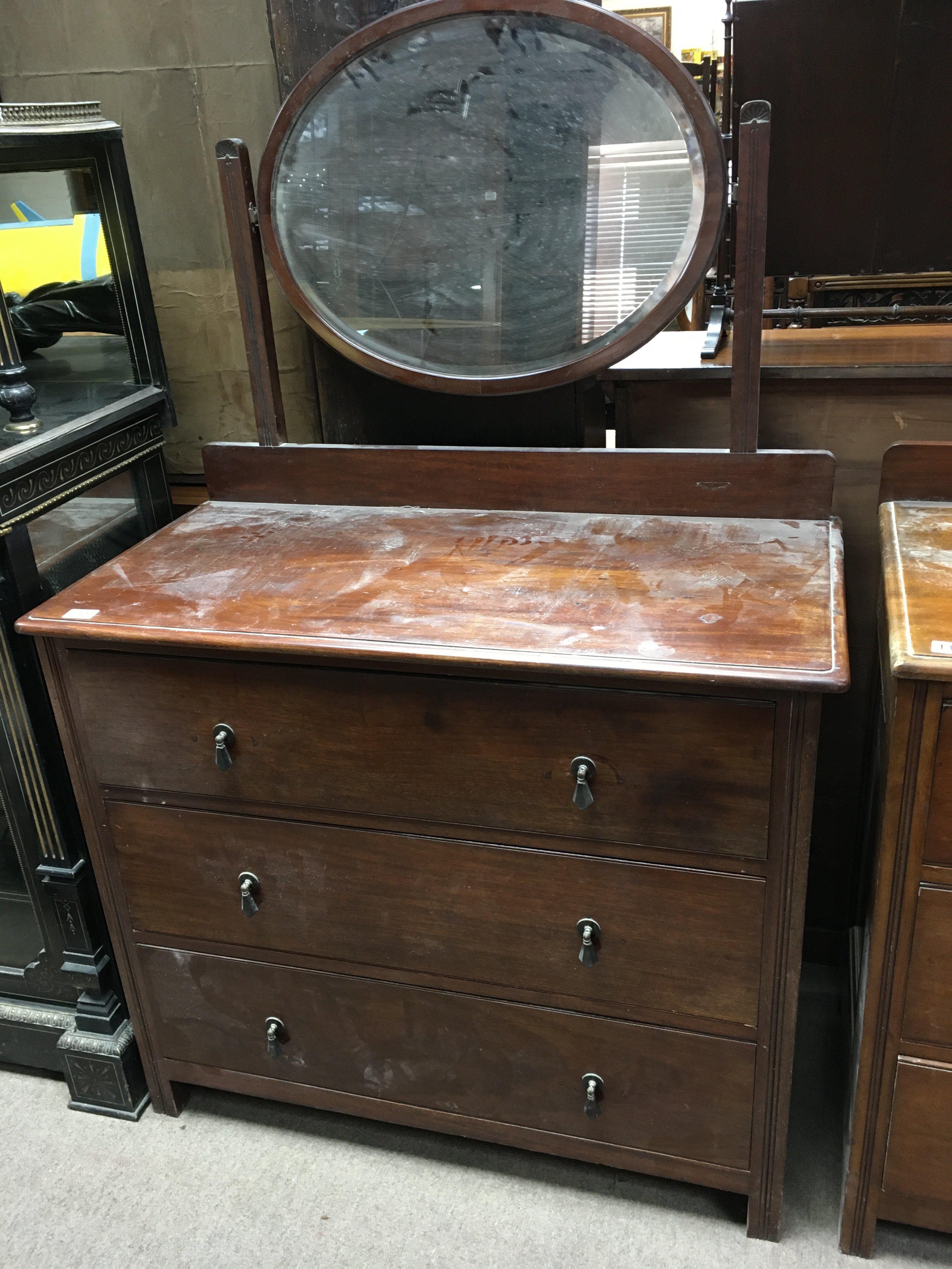 A 1930s mirror backed 3 draw chest. 100 x 150 x 51