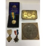 A group of WW1 medals, a memorial plaque (death pe