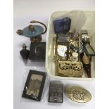 A collection of various items including vesta case