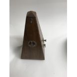 A mahogany case metronome .