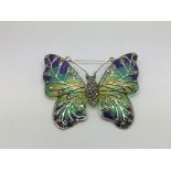 A large silver moth brooch set with marcasites and