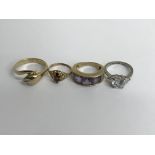 Four decorative rings including 9 ct .