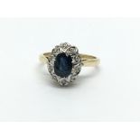 An 18ct gold sapphire and diamond cluster ring, ap