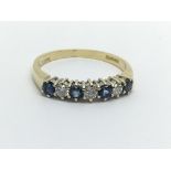 An 18ct gold Ceylon sapphire and diamond half eter