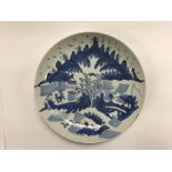 An early Blue and white Chinese porcelain plate with hand painted landscape.