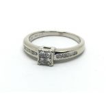 An 18ct white gold ring, set with four approx 0.25